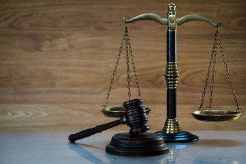 Law and Justice concept on wooden background