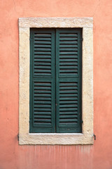 One window with closed shutters.