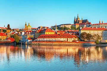 Obraz premium Scenic view Charles bridge and historical center of Prague, buildings and landmarks of old town at sunset, Prague, Czech Republic