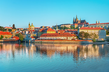 Obraz premium Scenic view Charles bridge and historical center of Prague, buildings and landmarks of old town at sunset, Prague, Czech Republic