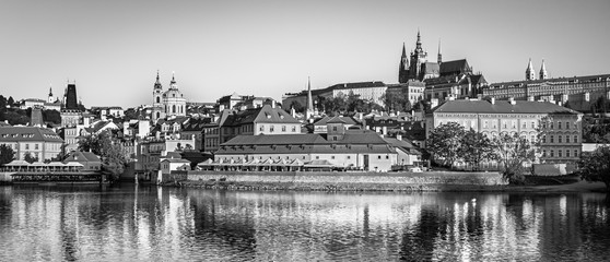 Scenic view Charles bridge and historical center of Prague, buildings and landmarks of old town at sunset, Prague, Czech Republic