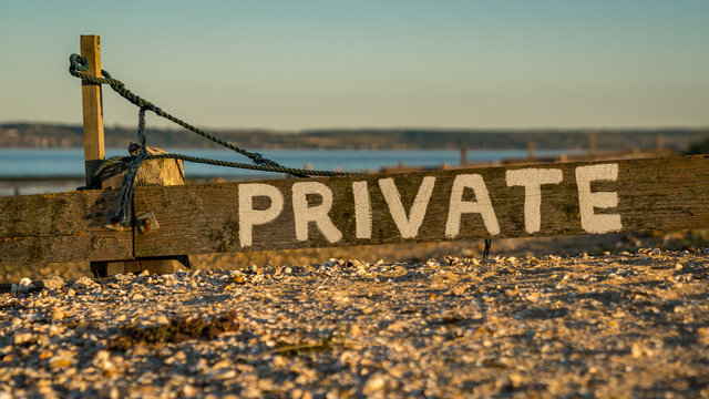 Sign: Private, seen at Shellness Beach on the Isle of Sheppey, Kent, England, UK