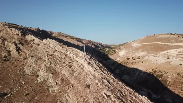 DRONE VIDEO GLIDING OVER A MOUNTAIN IN ZAHLE LEBANON WITH AMAZING VIEW OF SUNSET AND THE VILLAGE
