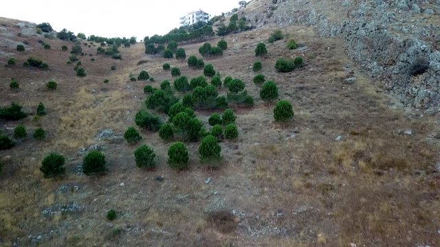 DRONE VIDEO GLIDING OVER A MOUNTAIN IN ZAHLE LEBANON WITH THE VIEW OF SUNRISE