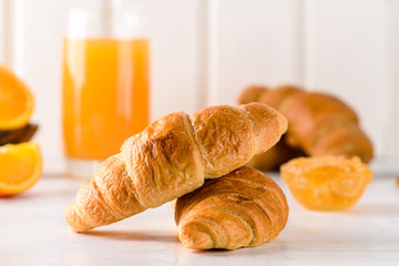 fresh croissant for breakfast with orange juice, breakfast concept