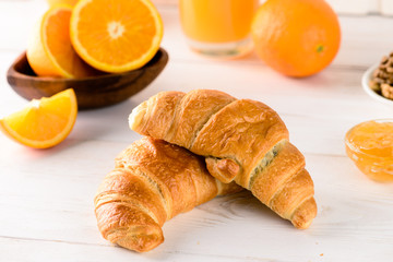 fresh croissant for breakfast with orange juice, breakfast concept