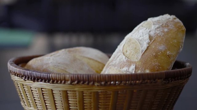 a close up slow zoom on a pair of crusty golden brown sourdough bread