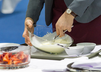 Obraz na płótnie Canvas Table side Service Dinner, Hands preparing cream