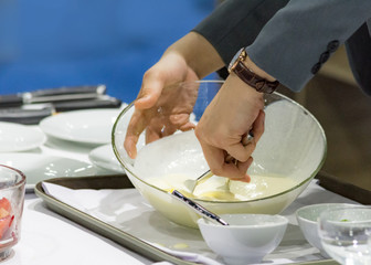 Table side Service Dinner, Hands preparing cream