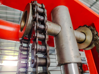 Sun shines falling chain of forklift in factory