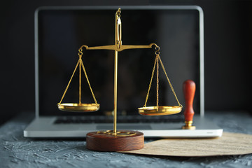 Judge gavel and legal book on wooden table, justice and law concept