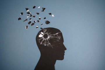 Brain disorder symbol presented by human head made form paper . Creative idea for Alzheimer's...