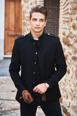 Young handsome man wearing black clothes
