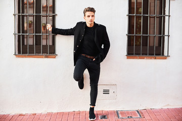 Handsome young man in black
