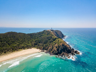 Tallows Beach at Byron Bay from an aerial view with blue water