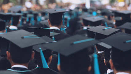 close up Crowd group shot of graduation hats during commencement success graduates of the...