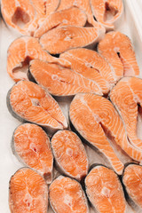 raw salmon steaks, food background