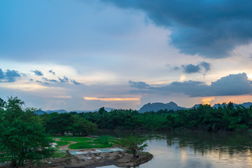 Obraz premium Blue sky high peak mountains fog hills mist scenery river lake dam bay gulf wildlife National park views Kanchanaburi, Thailand.
