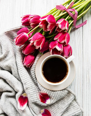 Cup of coffee and pink tulips