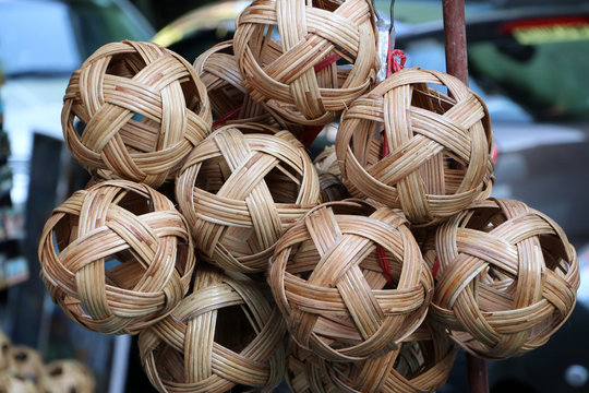 Rattan ball hanging in a bunch. In Myanmar called “chinlone” and in Thailand called “Takraw”.