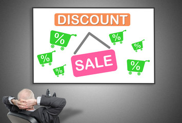 Businessman looking at discount concept