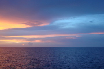 The landscape from the deck of the ocean liner is incredible beauty of the bright natural scenery of the sunset on the sea horizon.
