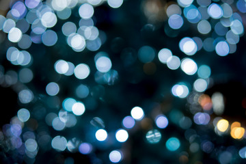 Fototapeta na wymiar Christmas tree decorations such as gifts, light, color, dolls make beautiful. The light is bokeh.