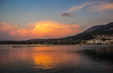 soft focus sun rise morning twilight waterfront harbor small village on tropic mountain island 