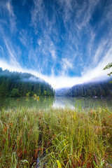 Majestic summer view of mountain lake Lacul Rosu or Red Lake or Killer Lake