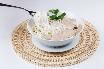 Traditional oriental cuisine of  Vietnam. Pho bo soup with rice noodles, beef, pepper, wheat germ, greens