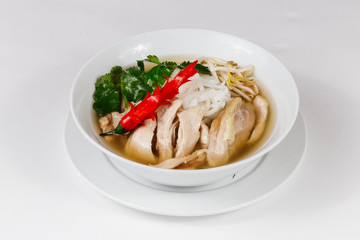 Traditional oriental cuisine of  Vietnam. Soup pho ga with rice noodles, chicken, pepper, wheat germ, greens