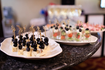 Canapes snacks for furshet on the plate in the restaurant