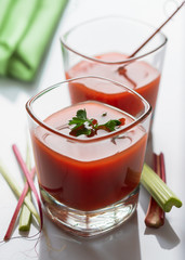 Fresh tomato juice with ripe tomatoes and greens. Selective focus