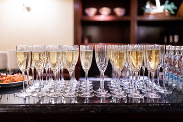 Glasses with champagne on the table in restaurant