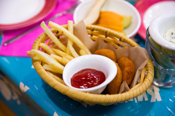 French fries with ketchup on the table