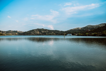 blue lake with cloudy sky, nature series