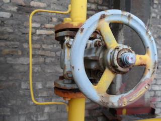 yellow pipe with valve open close . industry
