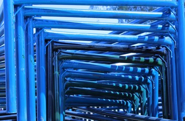 tunnel view of wrought iron beds placed in the market shop