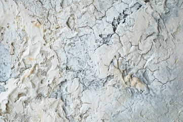 Stucco on a white wall with old plaster. Texture