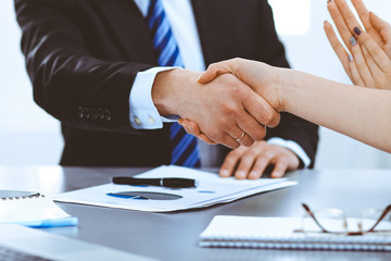 Business people shaking hands, finishing up a meeting