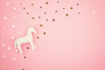 Flat lay with white unicorn and stars © netrun78