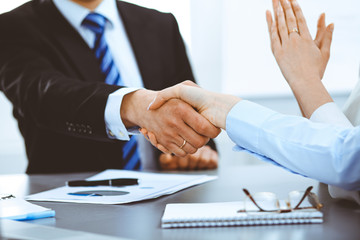 Business people shaking hands, finishing up a meeting