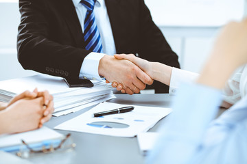 Business people shaking hands, finishing up a meeting
