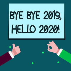 Word writing text Bye Bye 2019 Hello 2020. Business photo showcasing saying goodbye to last year and welcoming another good one Two Businessmen Hands Gesturing the Thumbs Up and Okay Sign for