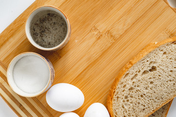 eggs and salt on wooden table