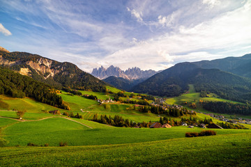 Santa Maddalena village with magical Dolomites mountains in background, Val di Funes valley, Trentino Alto Adige region, Italy, Europe. Wide view of dramatic Italian Dolomites landscape.