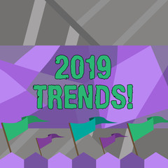Word writing text 2019 Trends. Business photo showcasing general direction in which something is developing or changing Blank Solid Colorful Pennant Streamer Flag on Stick Mounted on Picket Fence