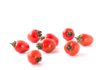 The small cherry tomatoes isolated on a white background