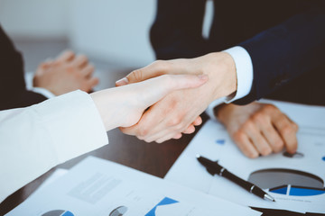 Business people shaking hands finishing up a meeting. Handshake at successful negotiation