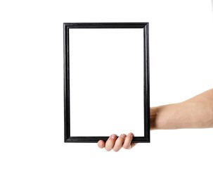 Hand holding black A4 frame. An empty frame with a white background. Close up. Isolated on white background